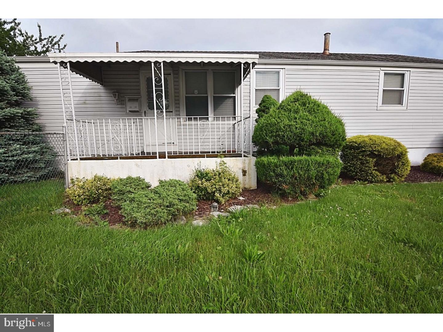 1131 Layton Road Philadelphia, PA 19115 - Photo 3 of 24 a front view of a house with a yard
