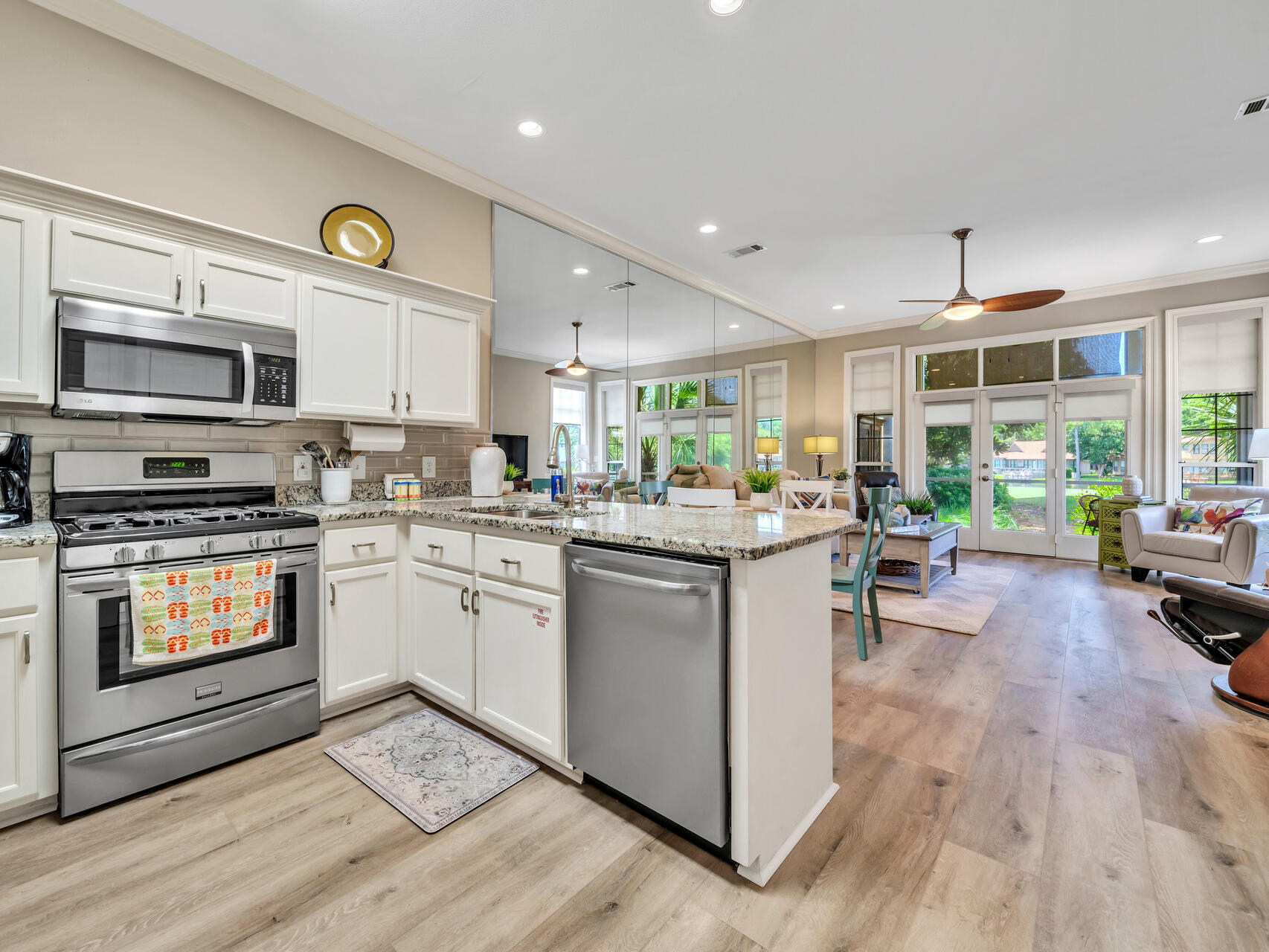 64 Vantage Point, Unit 64 Miramar Beach, FL 32550 - Photo 11 of 38 a kitchen with sink cabinets and wooden floor