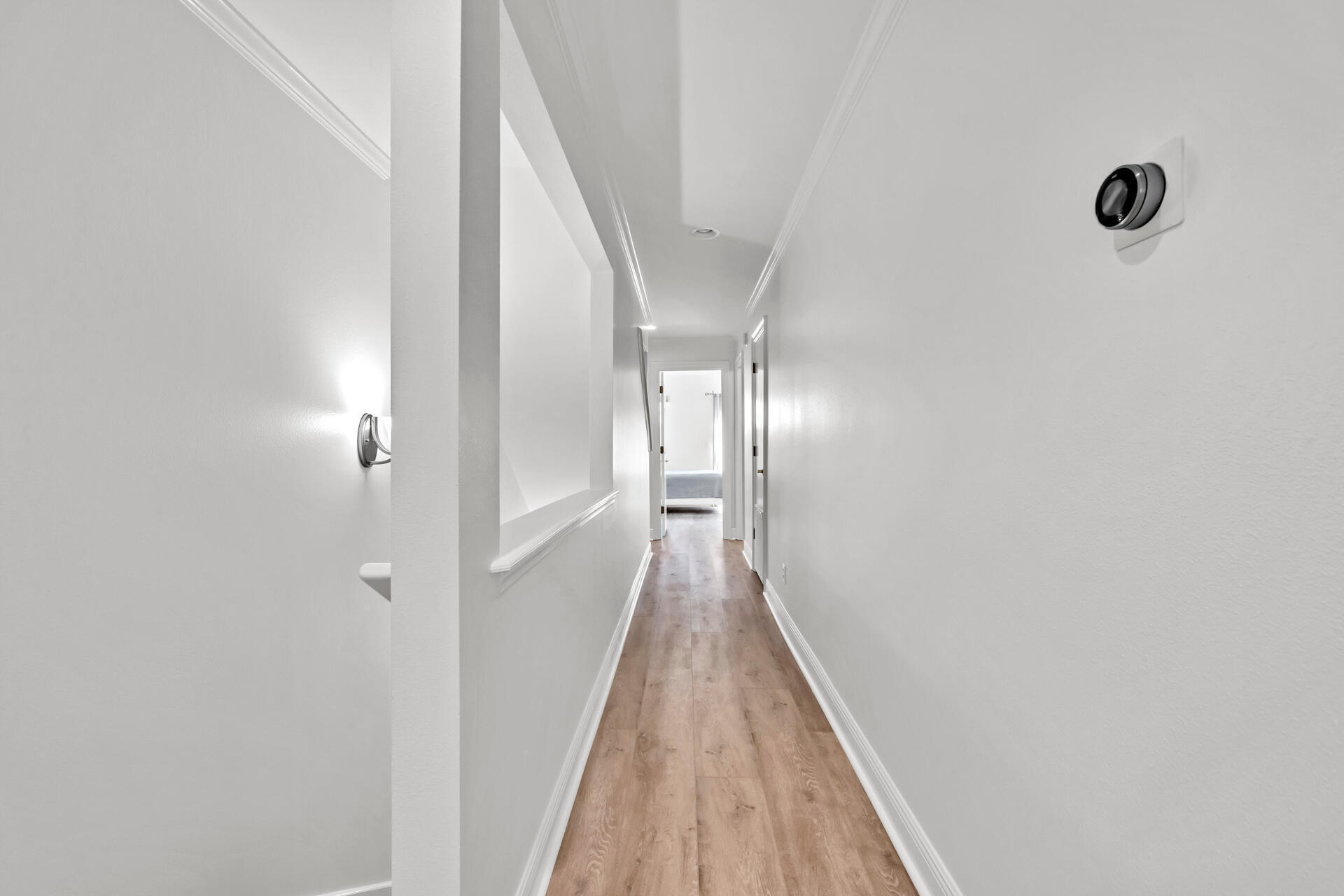 64 Vantage Point, Unit 64 Miramar Beach, FL 32550 - Photo 18 of 38 a view of a hallway with wooden floor and staircase
