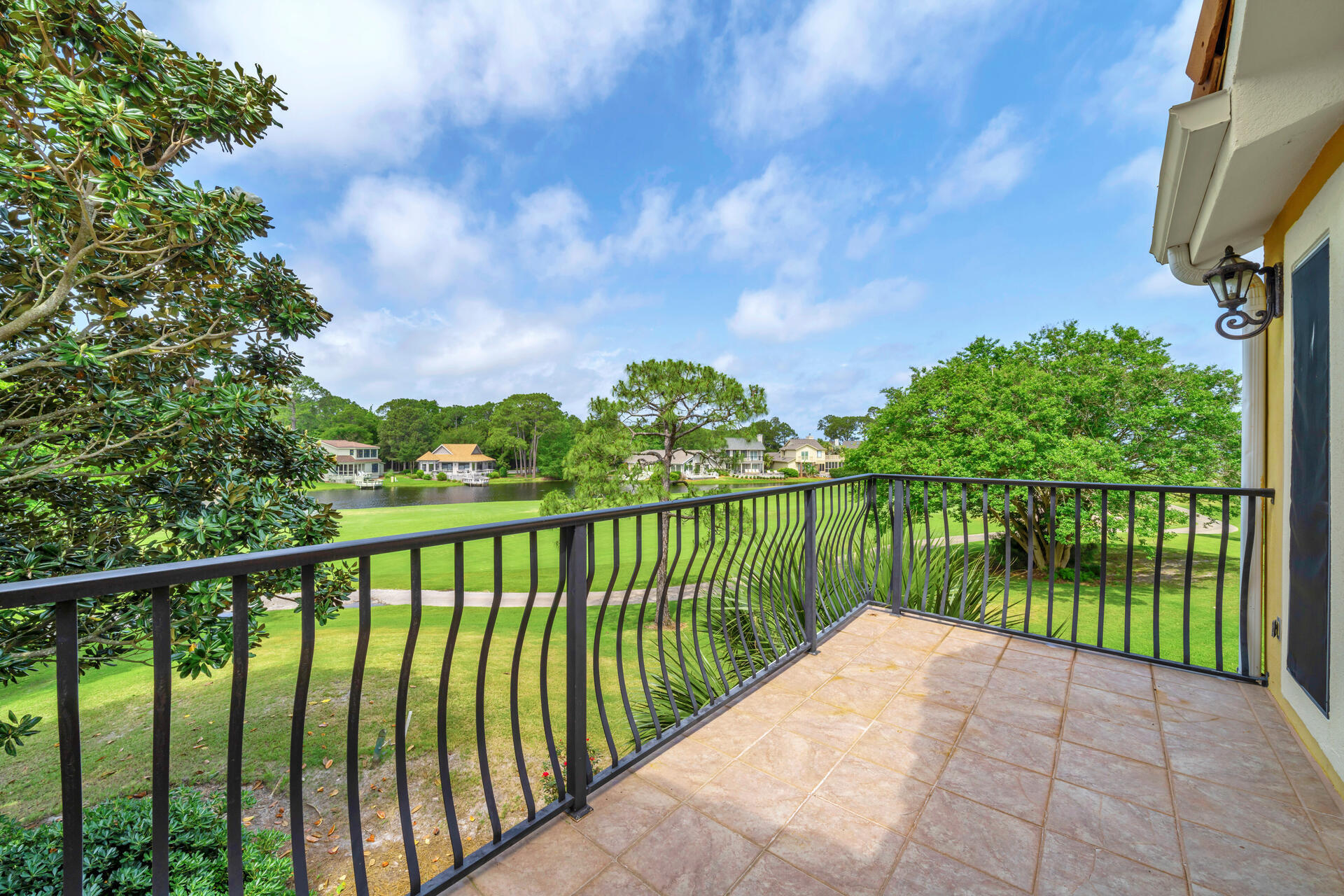 64 Vantage Point, Unit 64 Miramar Beach, FL 32550 - Photo 22 of 38 a balcony with trees in front of it