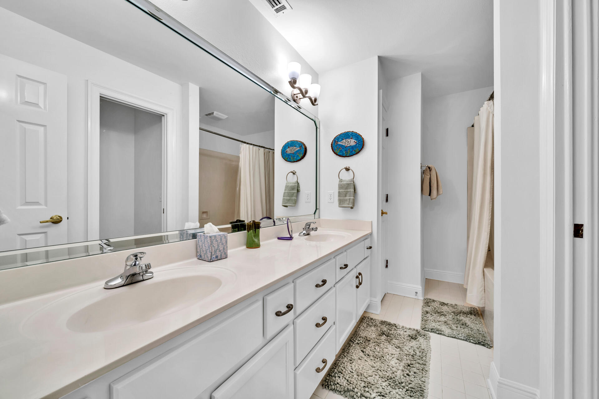 64 Vantage Point, Unit 64 Miramar Beach, FL 32550 - Photo 23 of 38 a bathroom with a double vanity sink mirror double and shower