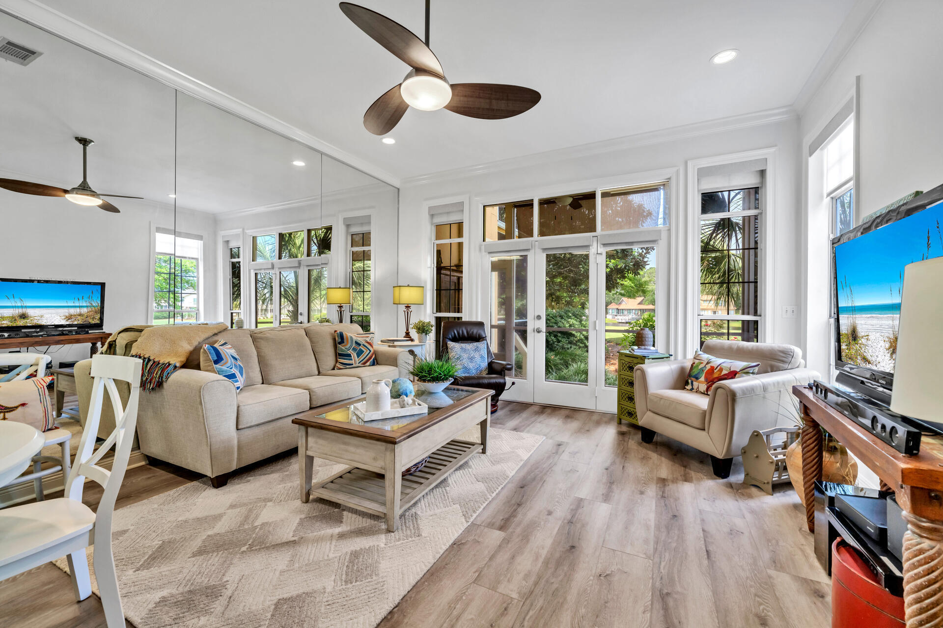64 Vantage Point, Unit 64 Miramar Beach, FL 32550 - Photo 6 of 38 a living room with furniture flat screen tv and a large window
