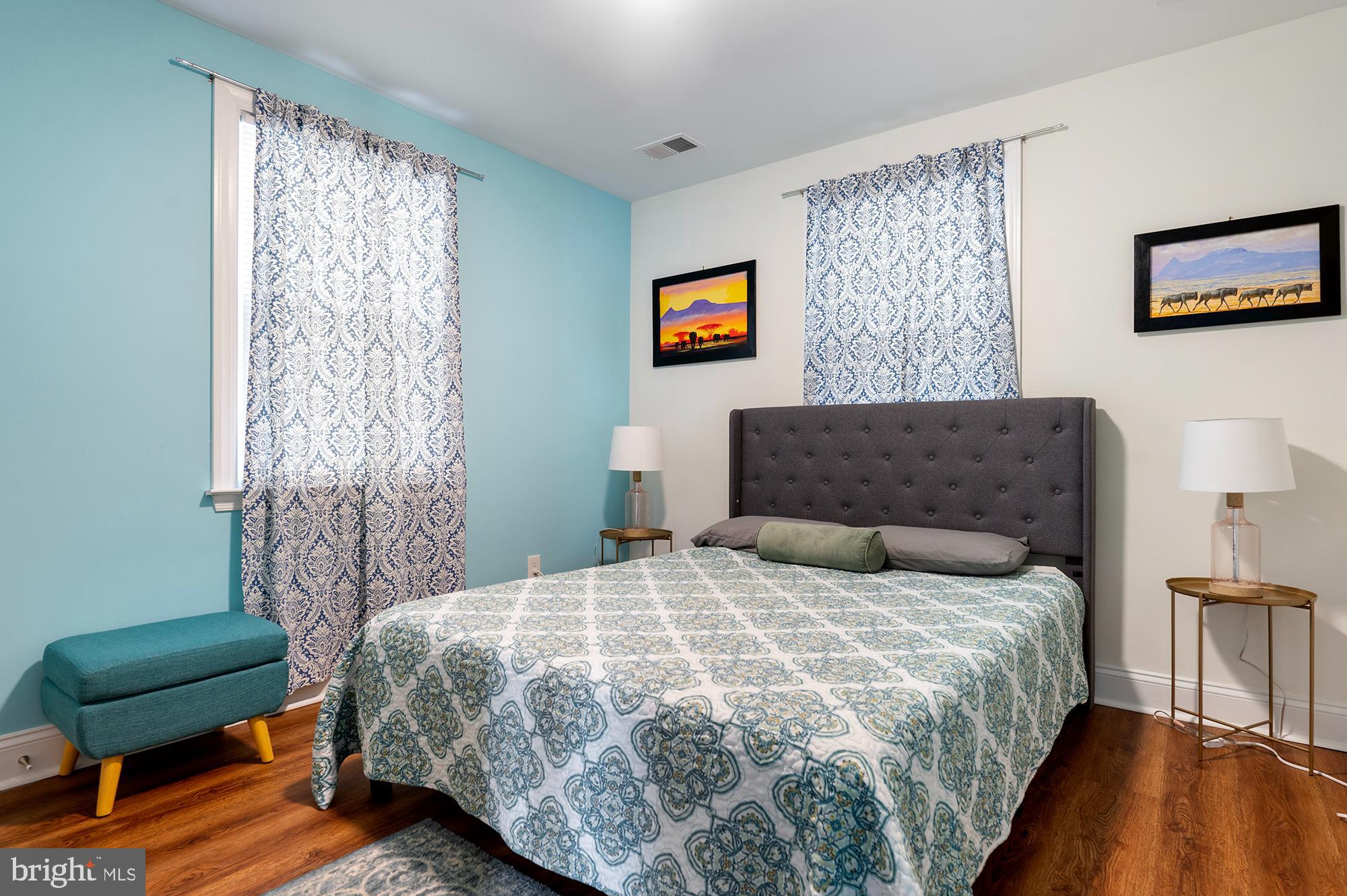 104 Wilson Boulevard Southwest Glen Burnie, MD 21061 - Photo 11 of 23 a bedroom with a bed and a couch