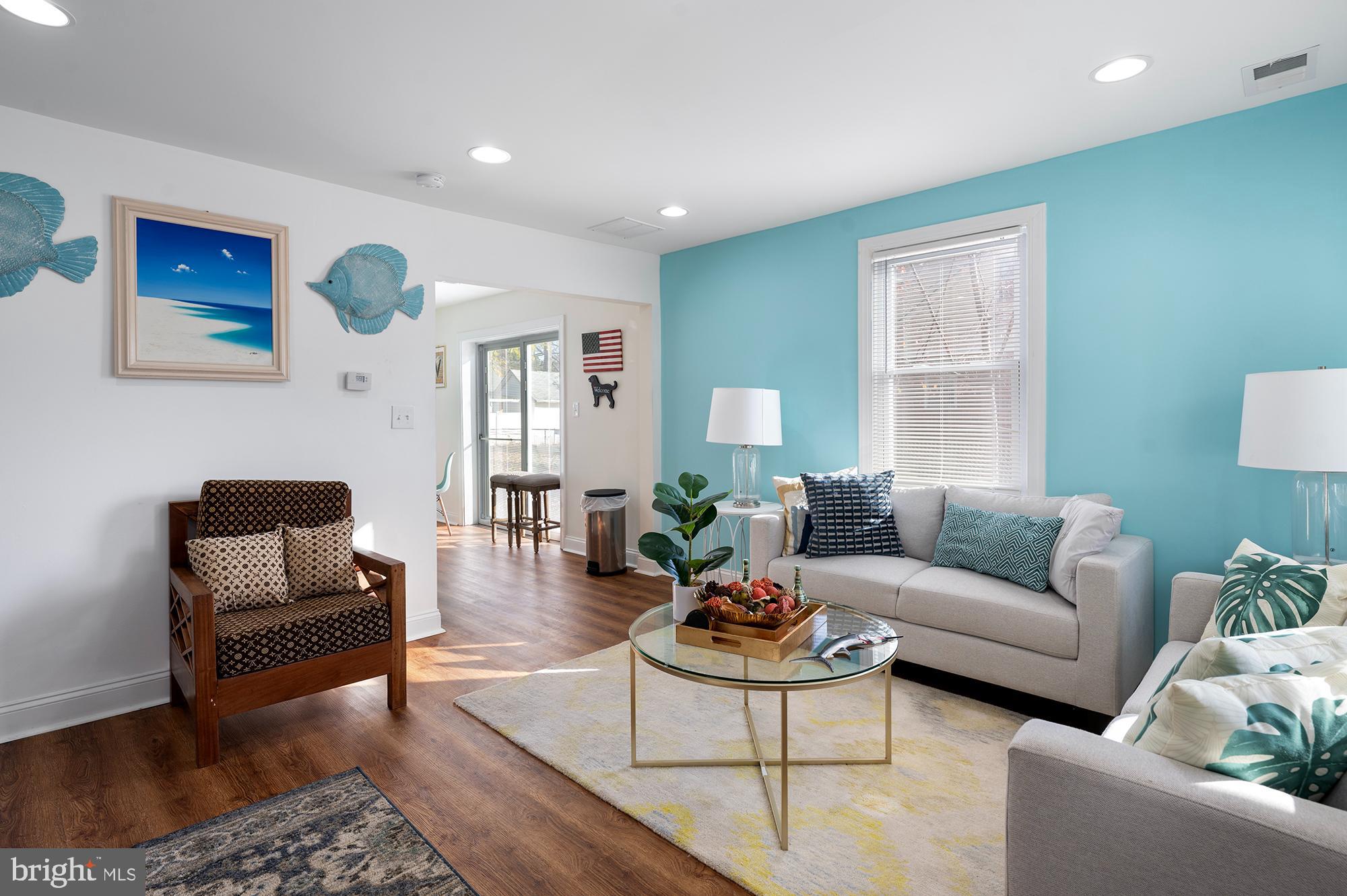 104 Wilson Boulevard Southwest Glen Burnie, MD 21061 - Photo 2 of 23 a living room with furniture and wooden floor