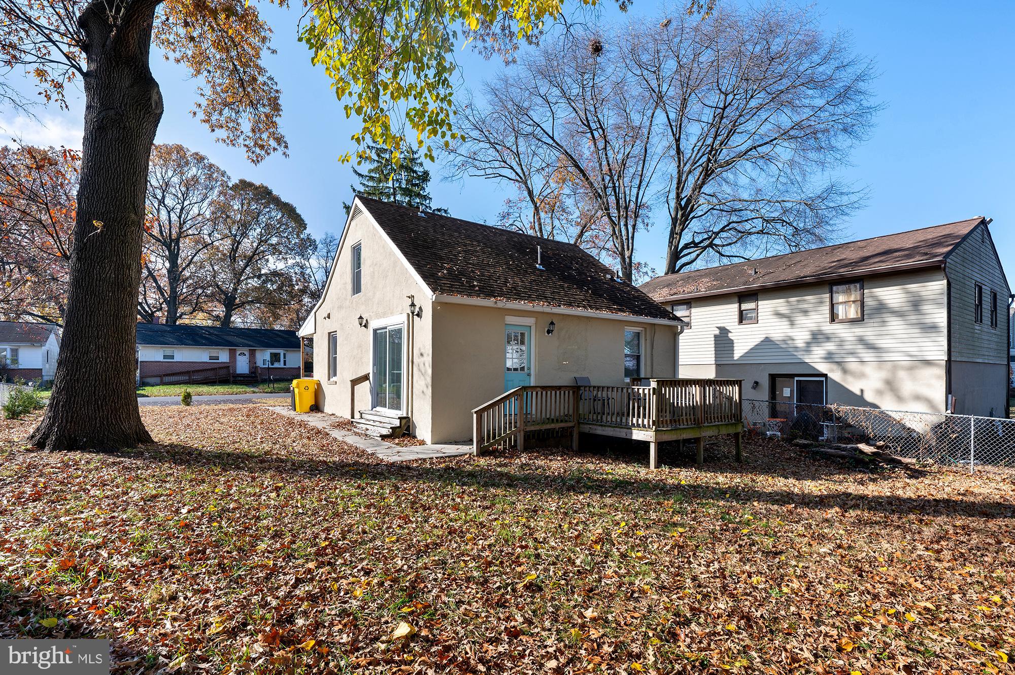 104 Wilson Boulevard Southwest Glen Burnie, MD 21061 - Photo 22 of 23 a view of a house with backyard and trees