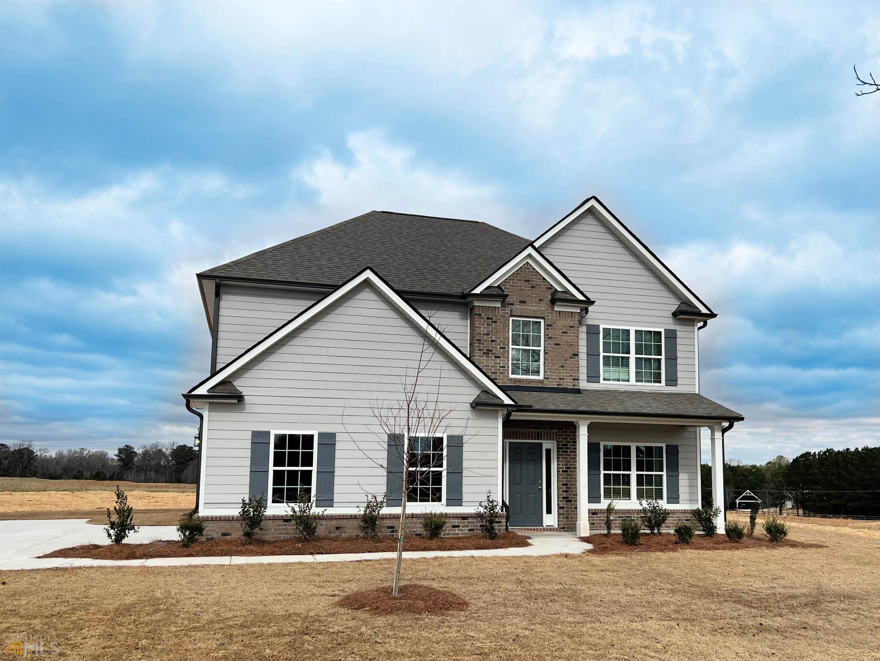 1301 Keys Ferry Road McDonough, GA 30252 - Photo 1 of 1 a front view of a house with a yard