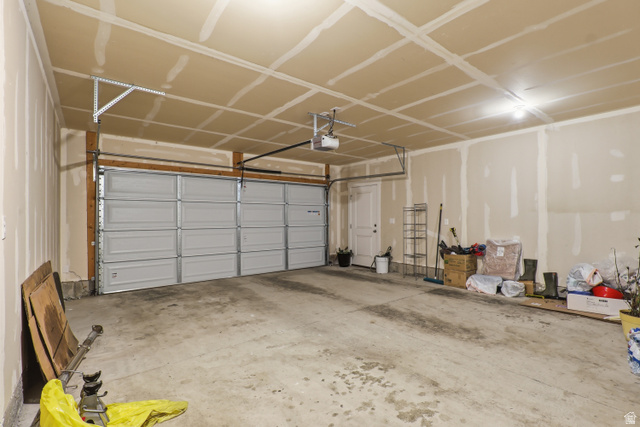2011 Wren Circle Logan, UT 84339 - Photo 19 of 20 Garage featuring a garage door opener