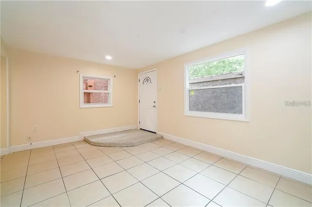 a view of an empty room with a window