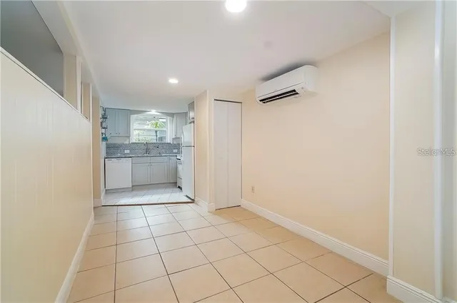a kitchen with appliances cabinets and a sink