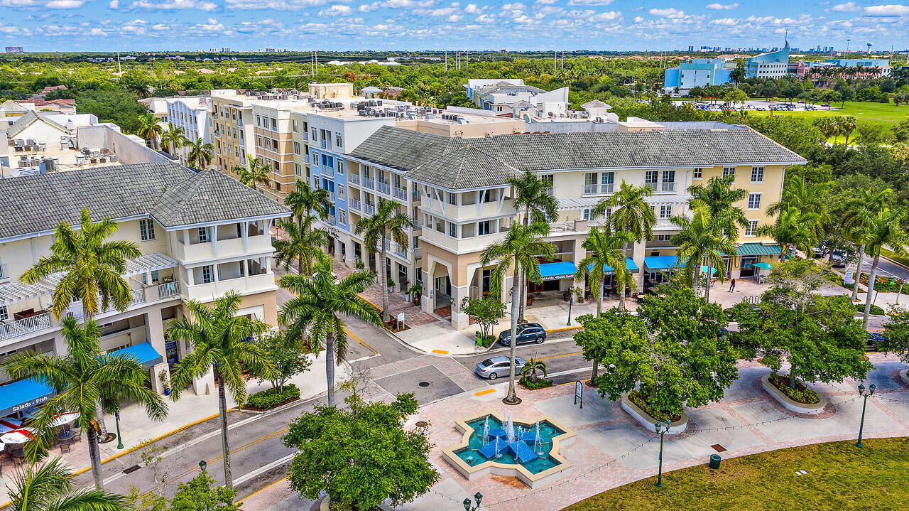 107 Rivinia Drive Jupiter, FL 33458 - Photo 26 of 28 an aerial view of multiple houses with a yard