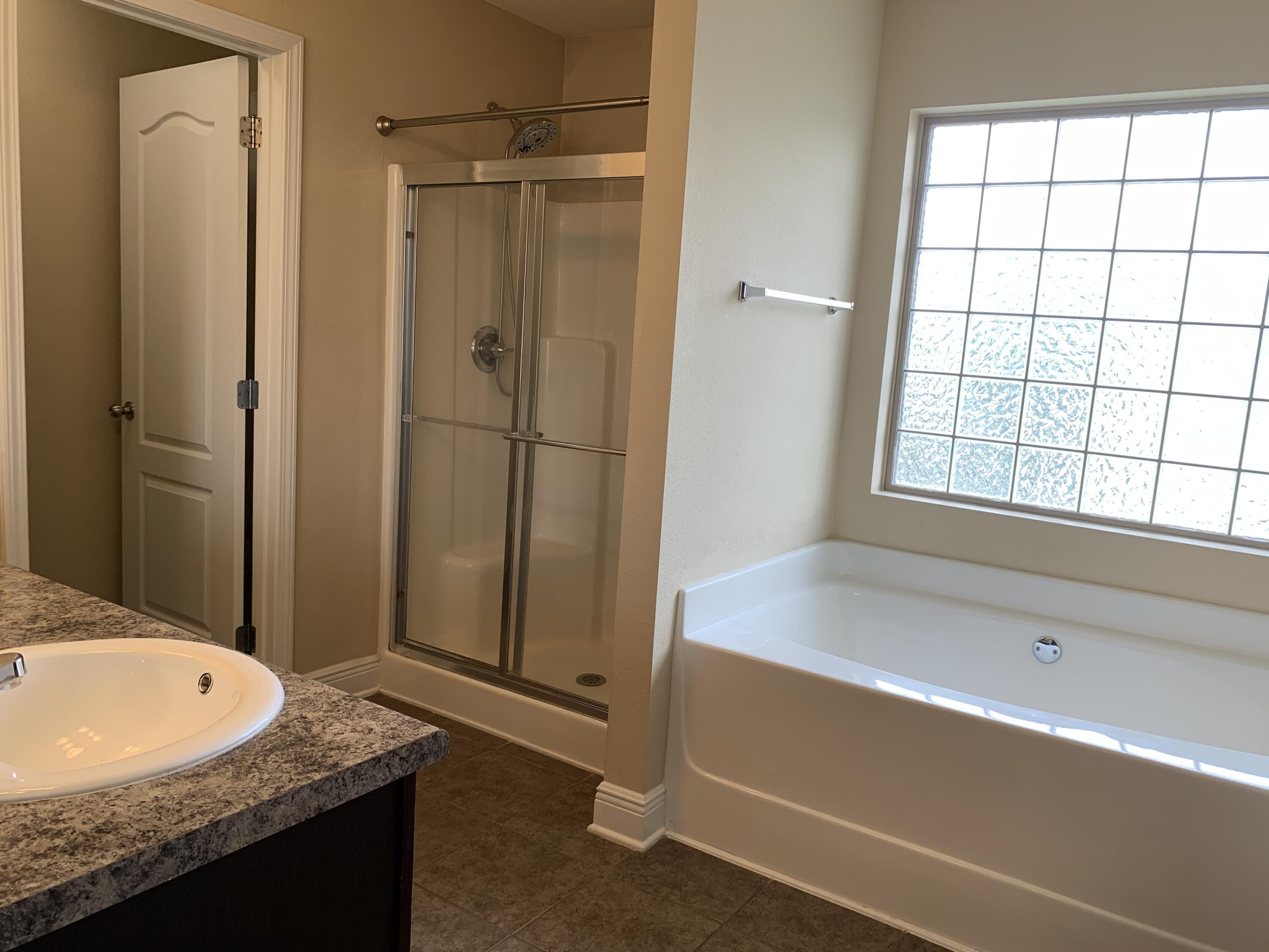 4587 Hermosa Road Crestview, FL 32539 - Photo 11 of 21 a bathroom with a granite countertop sink and a mirror