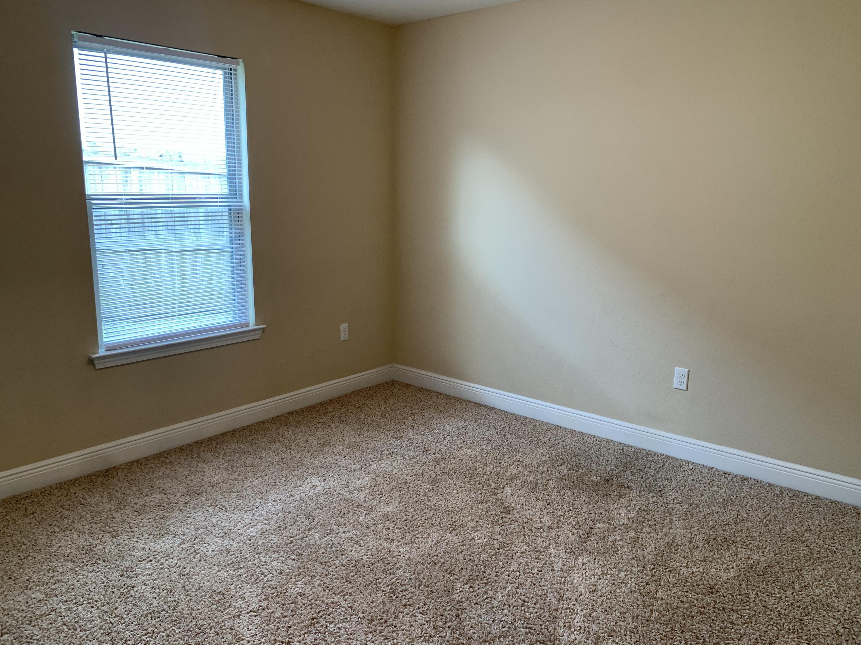 4587 Hermosa Road Crestview, FL 32539 - Photo 20 of 21 an empty room with windows