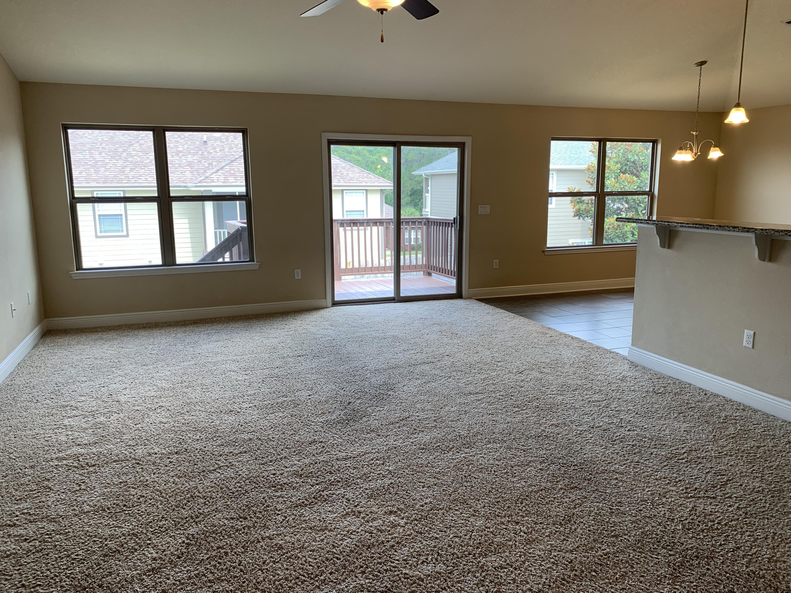 4587 Hermosa Road Crestview, FL 32539 - Photo 4 of 21 an empty room with windows