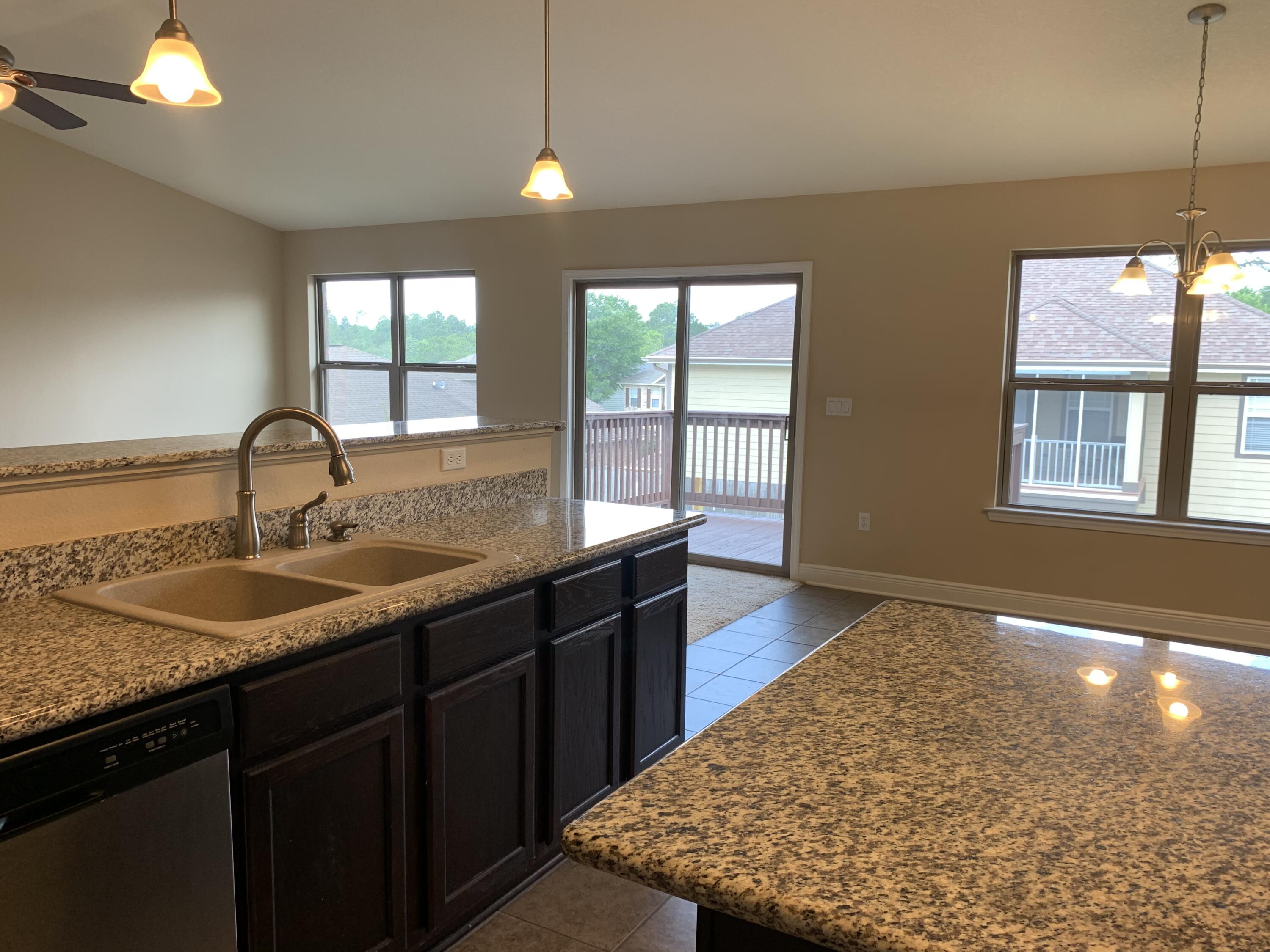 4587 Hermosa Road Crestview, FL 32539 - Photo 6 of 21 a kitchen with a sink and large window