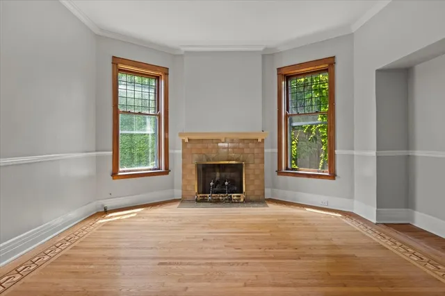 a bathroom with a toilet sink vanity and granite