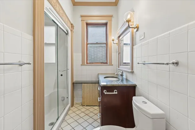 a view of an entryway with wooden floor and door