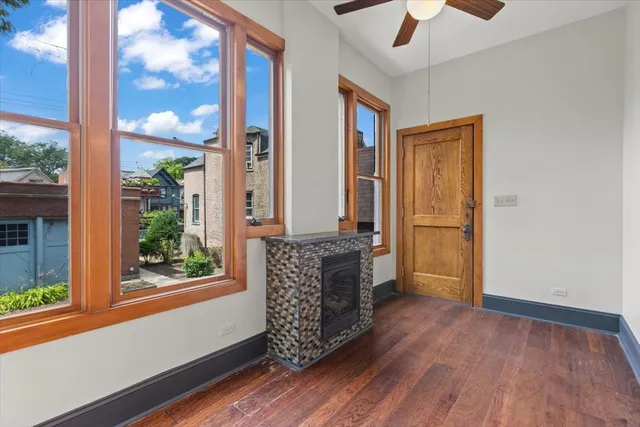 a view of a livingroom with a hall and kitchen view