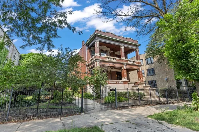 a front view of a house with trees