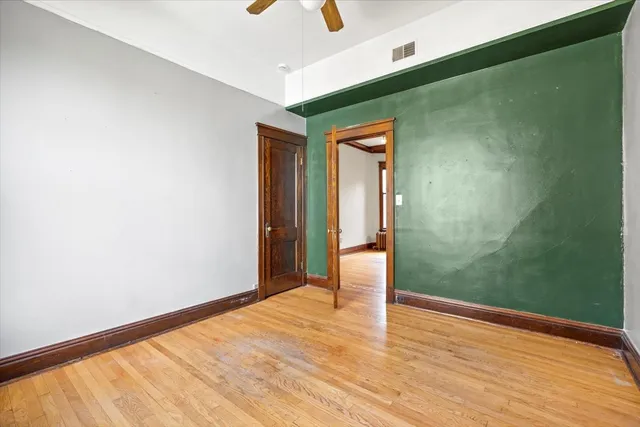 a kitchen with granite countertop a stove a sink and a refrigerator