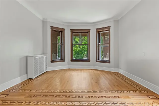 a living room with a fireplace and a window