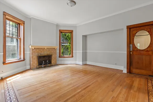 a view of room with window and hardwood floor