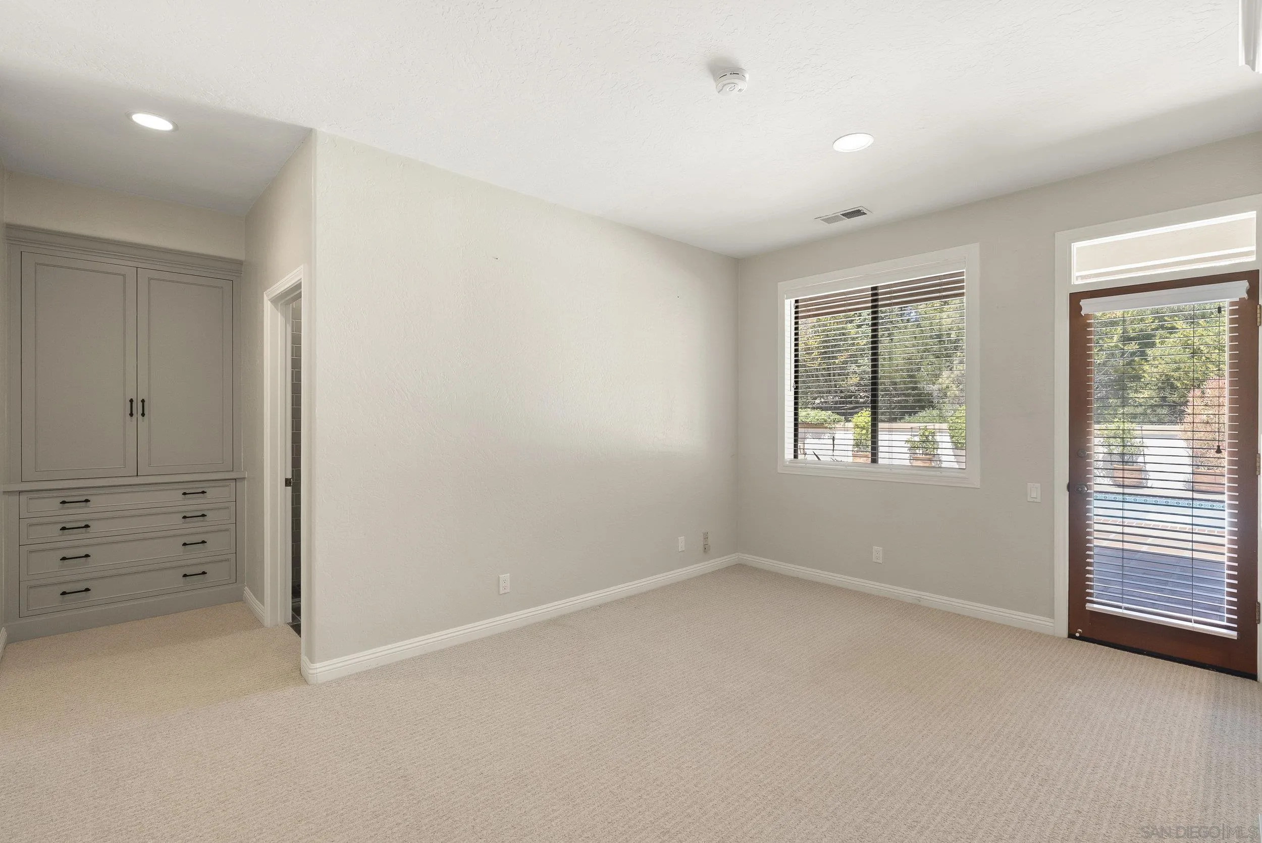 17207 El Caporal Rancho Santa Fe, CA 92067 - Photo 14 of 19 an empty room with windows