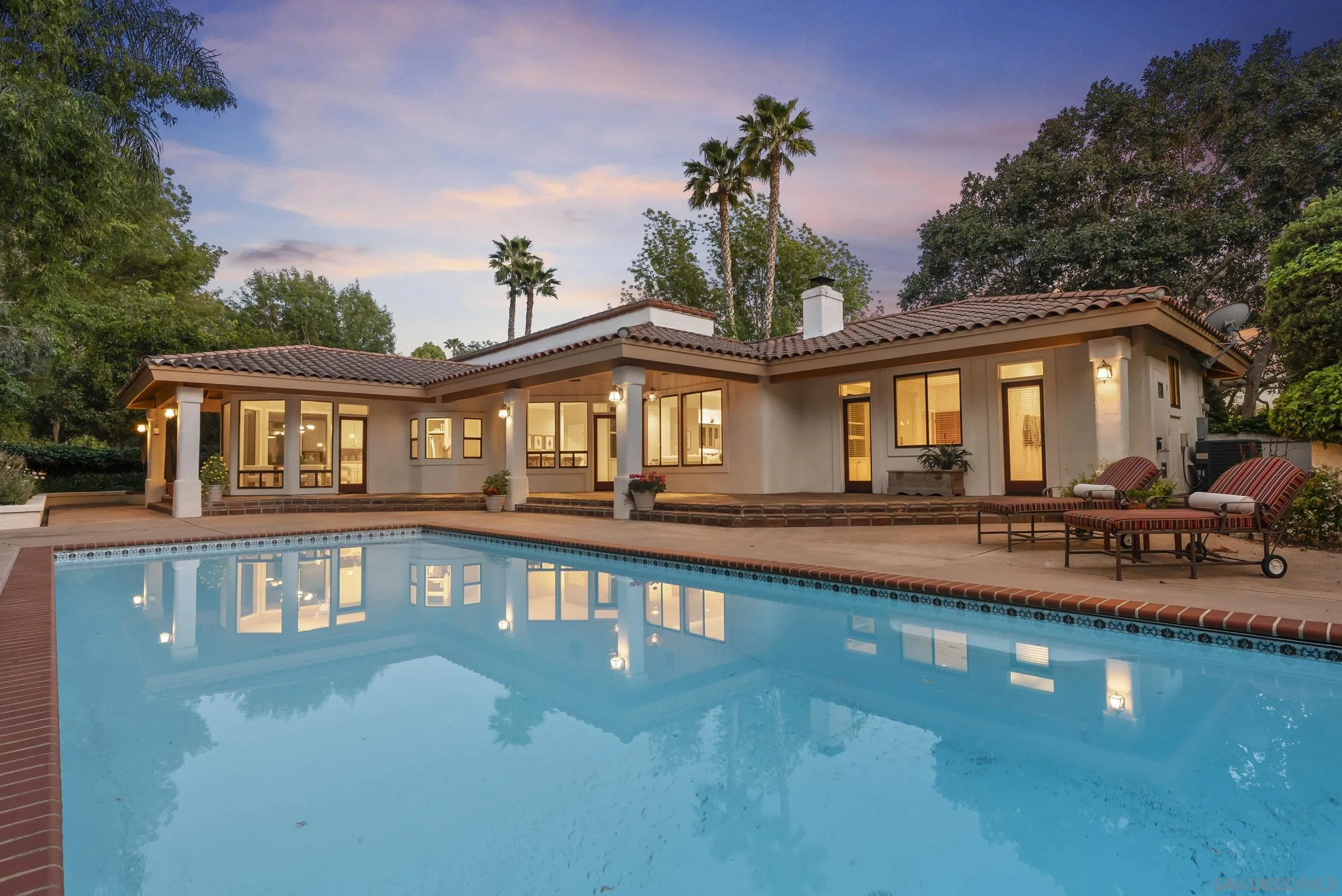 17207 El Caporal Rancho Santa Fe, CA 92067 - Photo 17 of 19 a front view of a house with swimming pool having outdoor seating