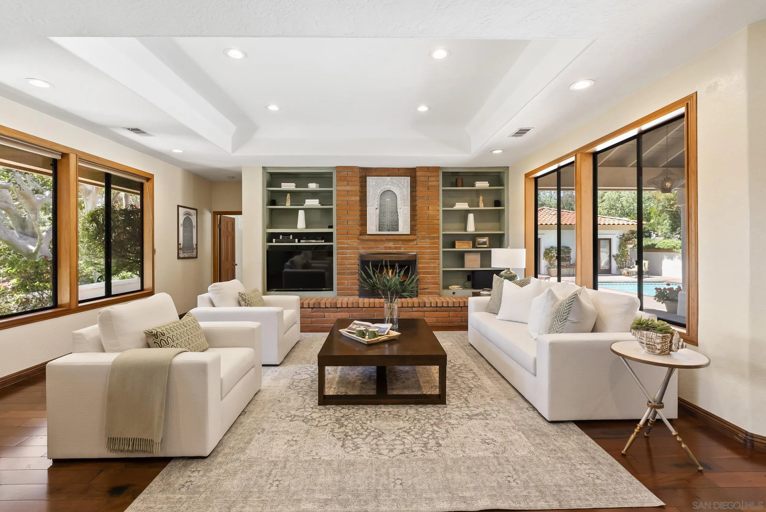 17207 El Caporal Rancho Santa Fe, CA 92067 - Photo 4 of 19 a living room with furniture and a large window