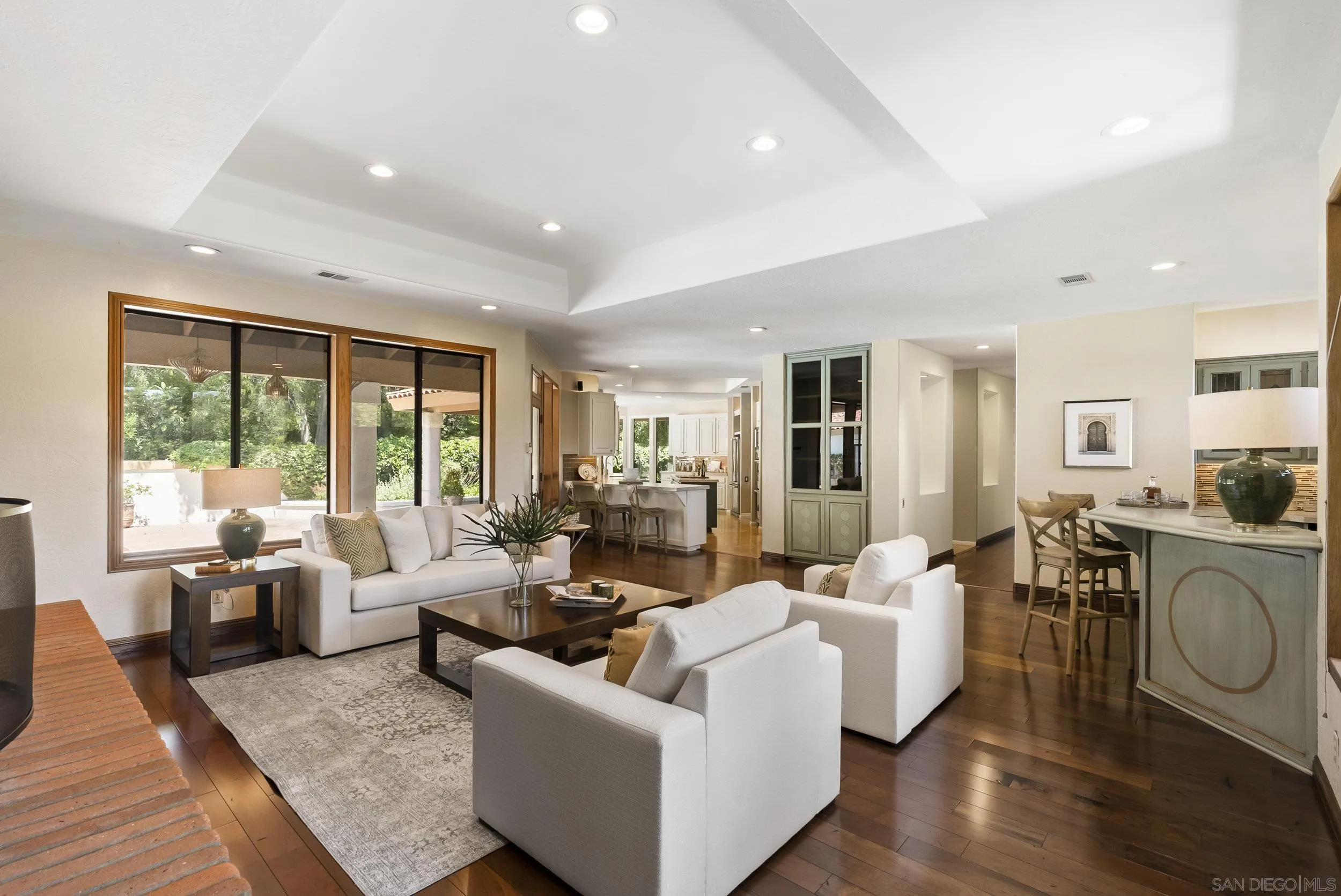 17207 El Caporal Rancho Santa Fe, CA 92067 - Photo 5 of 19 a living room with furniture and a table