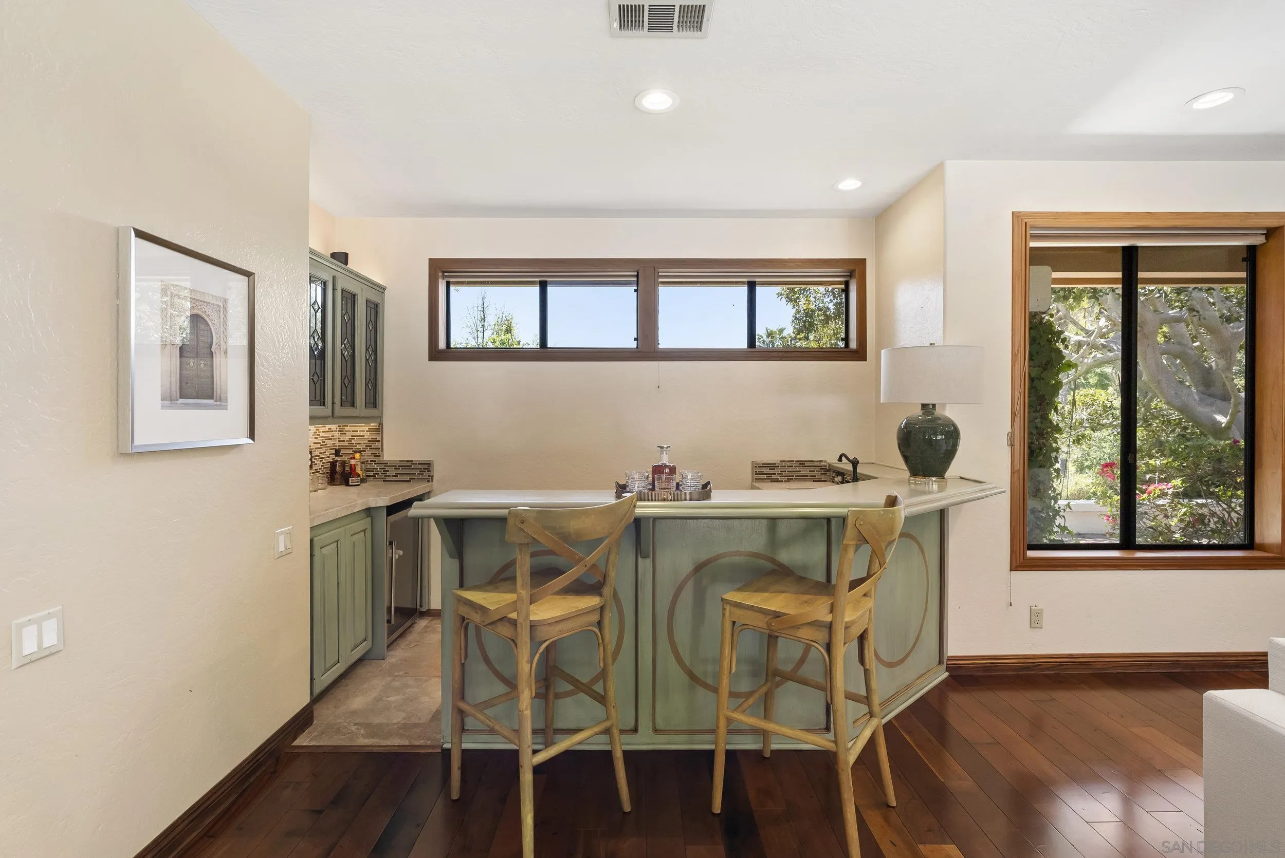 17207 El Caporal Rancho Santa Fe, CA 92067 - Photo 6 of 19 a view of a dining room with furniture window and wooden floor