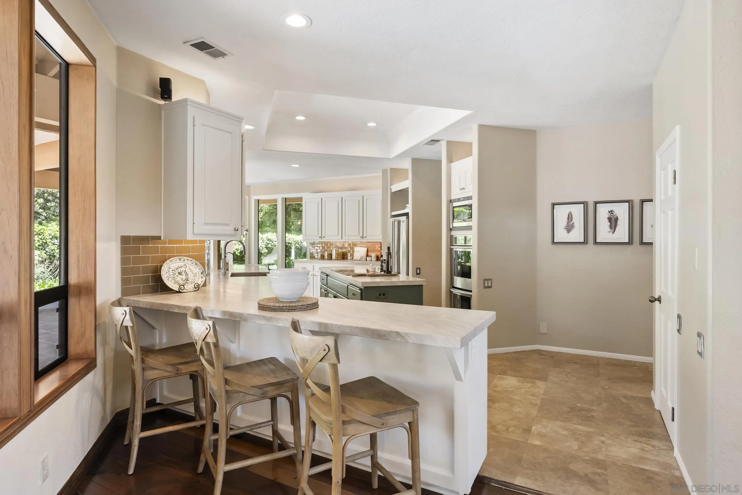 17207 El Caporal Rancho Santa Fe, CA 92067 - Photo 8 of 19 a view of a dining room with furniture and wooden floor