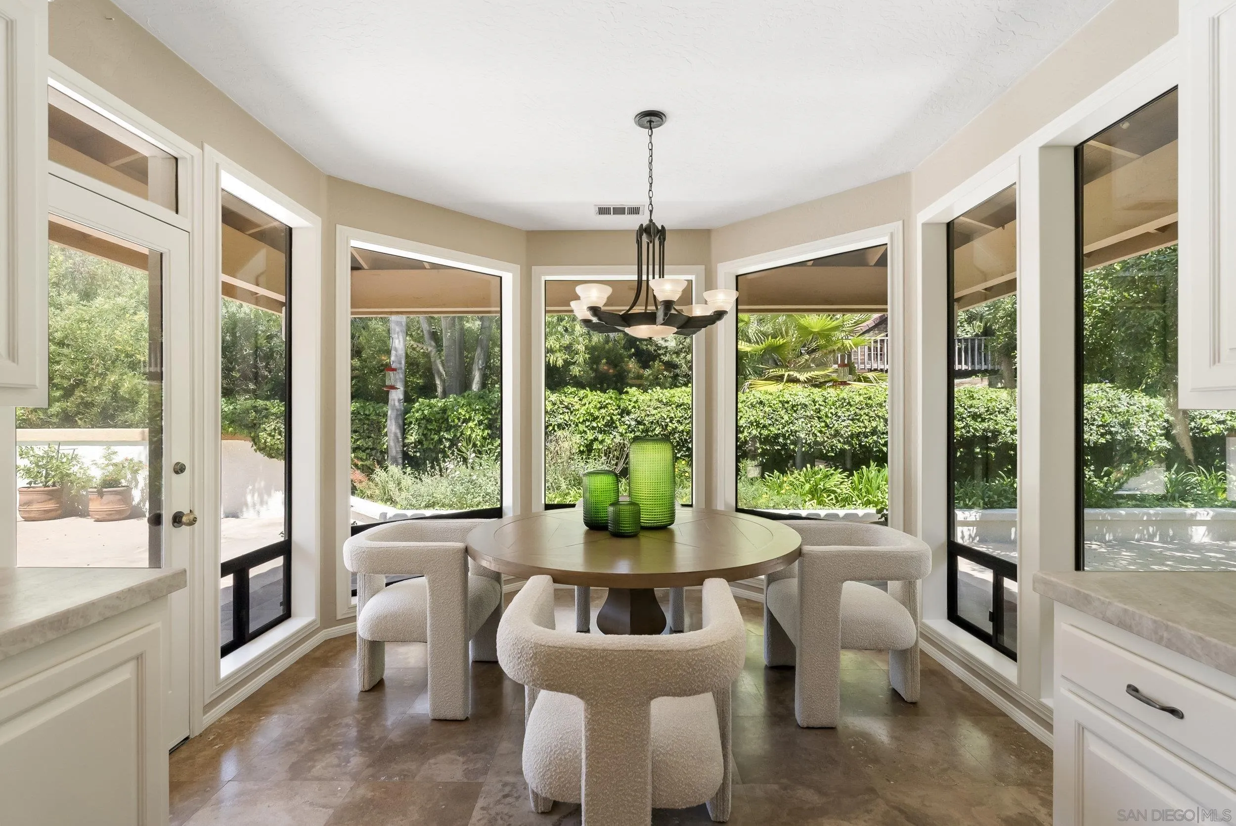 17207 El Caporal Rancho Santa Fe, CA 92067 - Photo 9 of 19 a living room with furniture and a large window