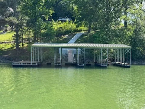 a view of a house with swimming pool and deck