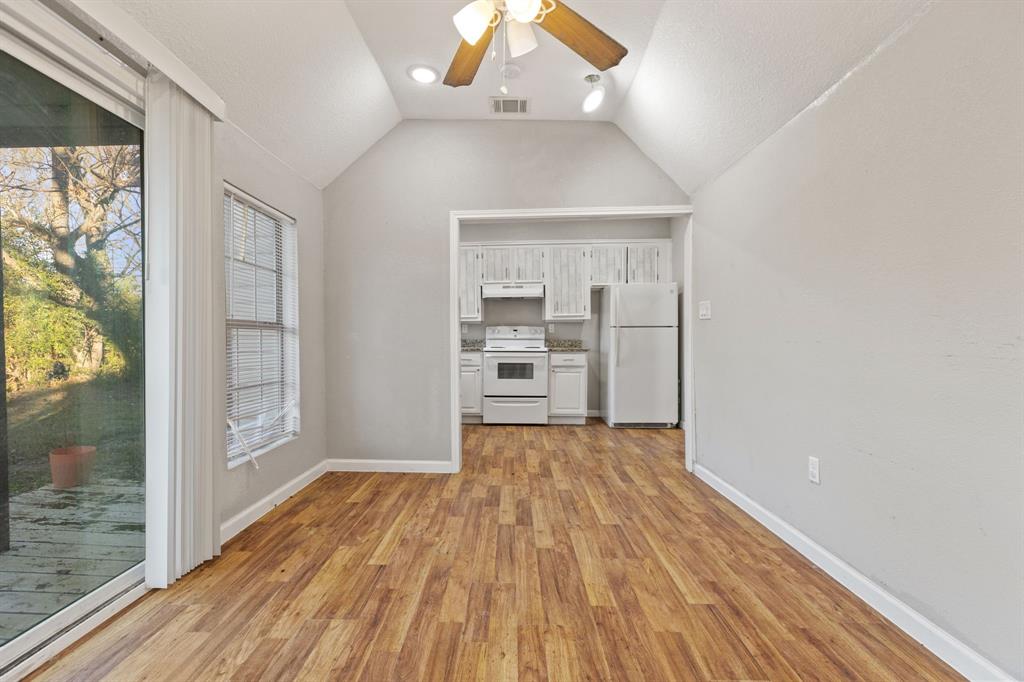 202 South Dunbar Lane Emory, TX 75440 - Photo 13 of 25 wooden floor in an empty room with a window