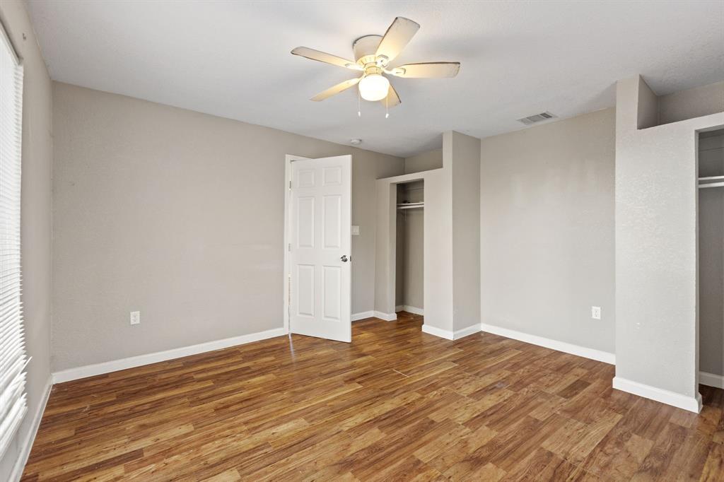 202 South Dunbar Lane Emory, TX 75440 - Photo 21 of 25 a view of room with wooden floor and a ceiling fan