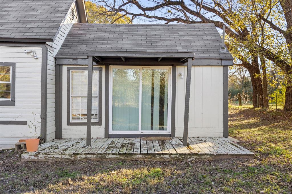 202 South Dunbar Lane Emory, TX 75440 - Photo 22 of 25 a front view of a house with a porch