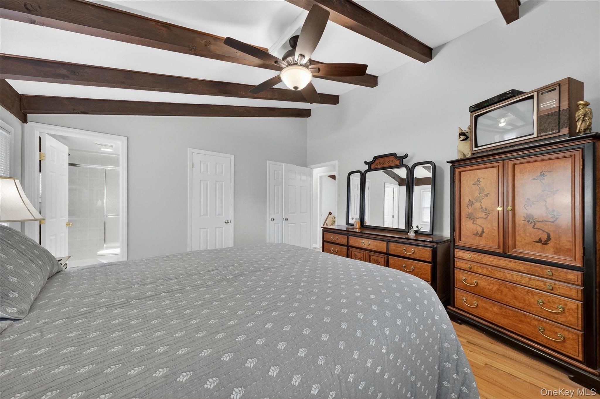 1 Rockledge Road Poughkeepsie, NY 12601 - Photo 19 of 36 Primary bedroom with beamed ceilings, ceiling fan and hardwood floors