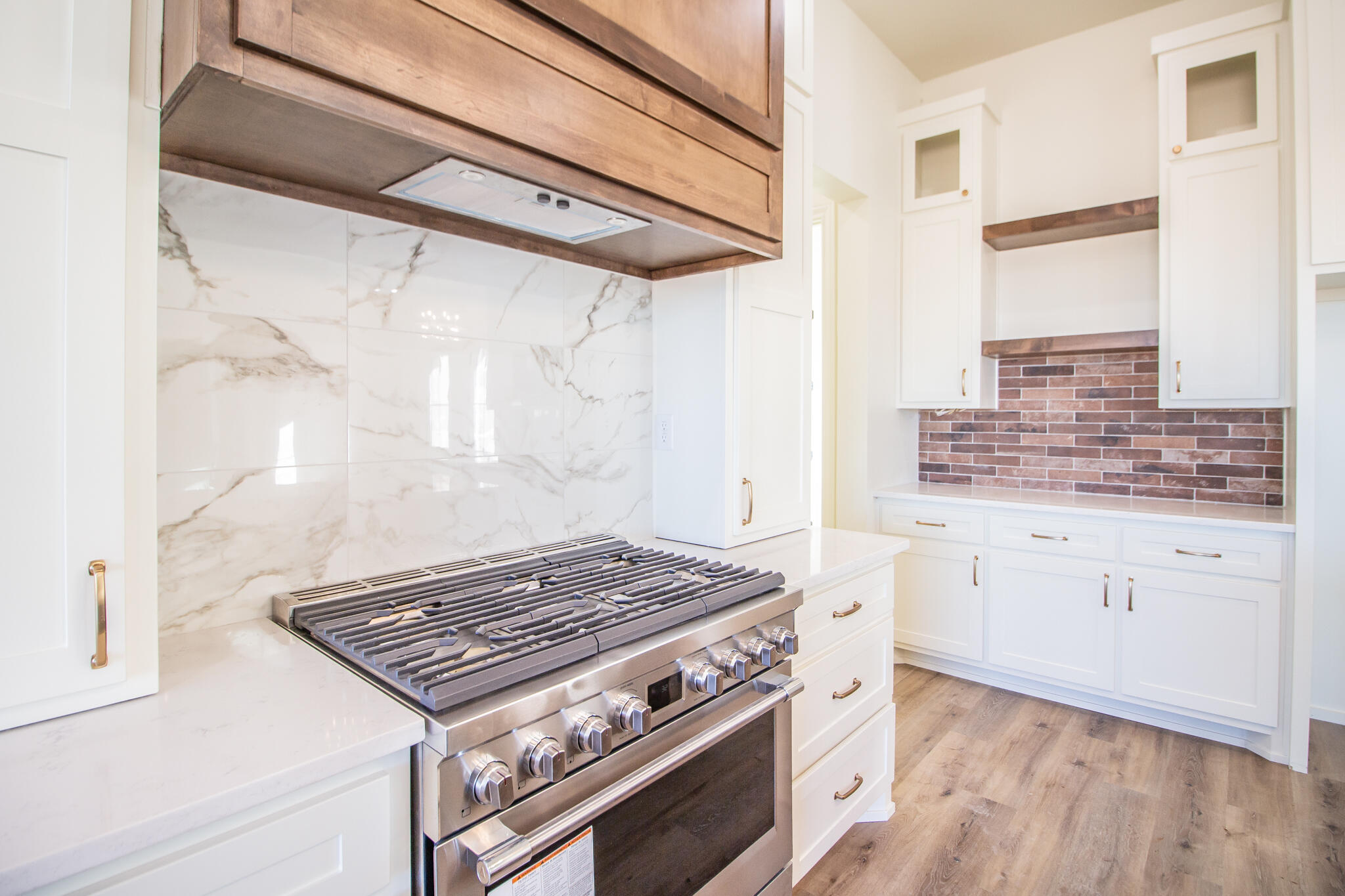 303 Juniper New Home, TX 79381 - Photo 11 of 31 a stove top oven sitting inside of a kitchen