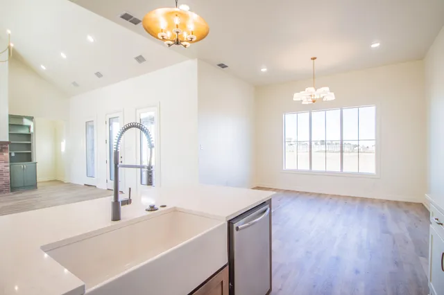 a kitchen with a sink and a window