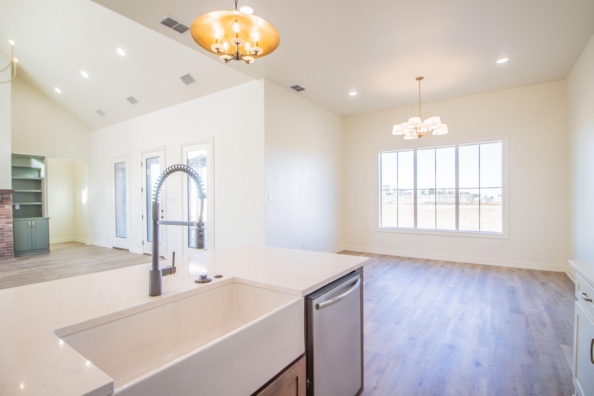 303 Juniper New Home, TX 79381 - Photo 12 of 31 a kitchen with a sink and a window