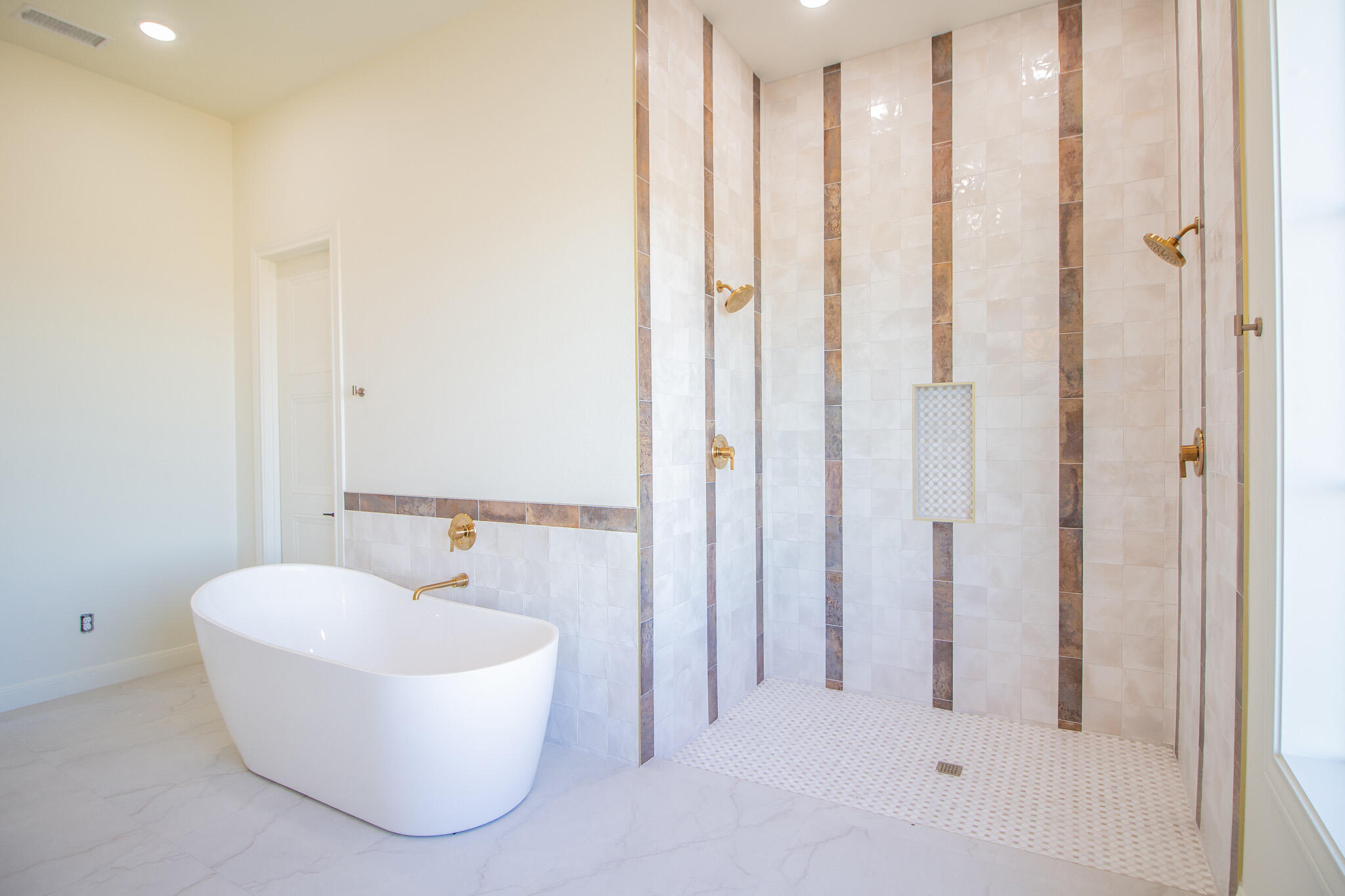 303 Juniper New Home, TX 79381 - Photo 16 of 31 a bathroom with a tub and shower