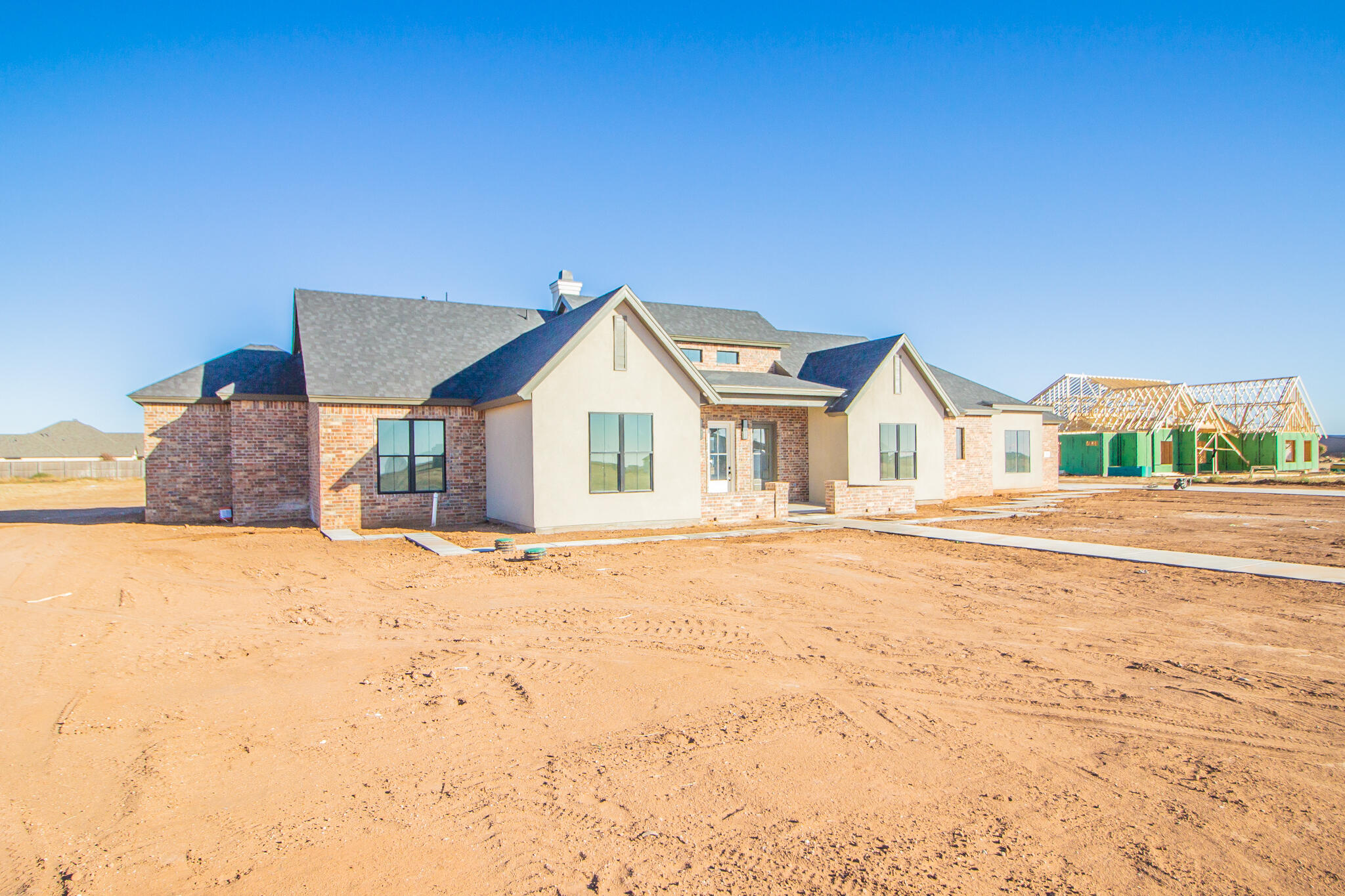 303 Juniper New Home, TX 79381 - Photo 2 of 31 a view of house with yard and staircase