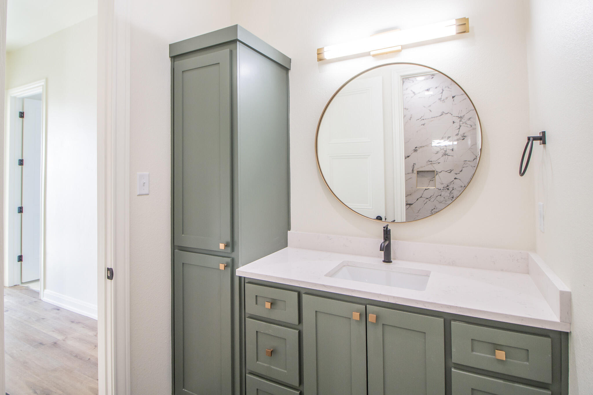 303 Juniper New Home, TX 79381 - Photo 24 of 31 a bathroom with a sink and a mirror
