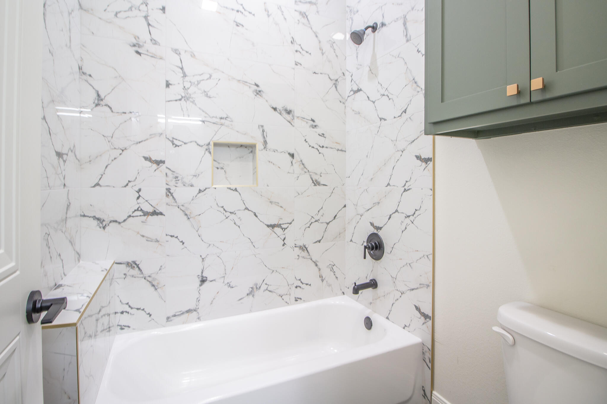 303 Juniper New Home, TX 79381 - Photo 25 of 31 a bathroom with a bathtub