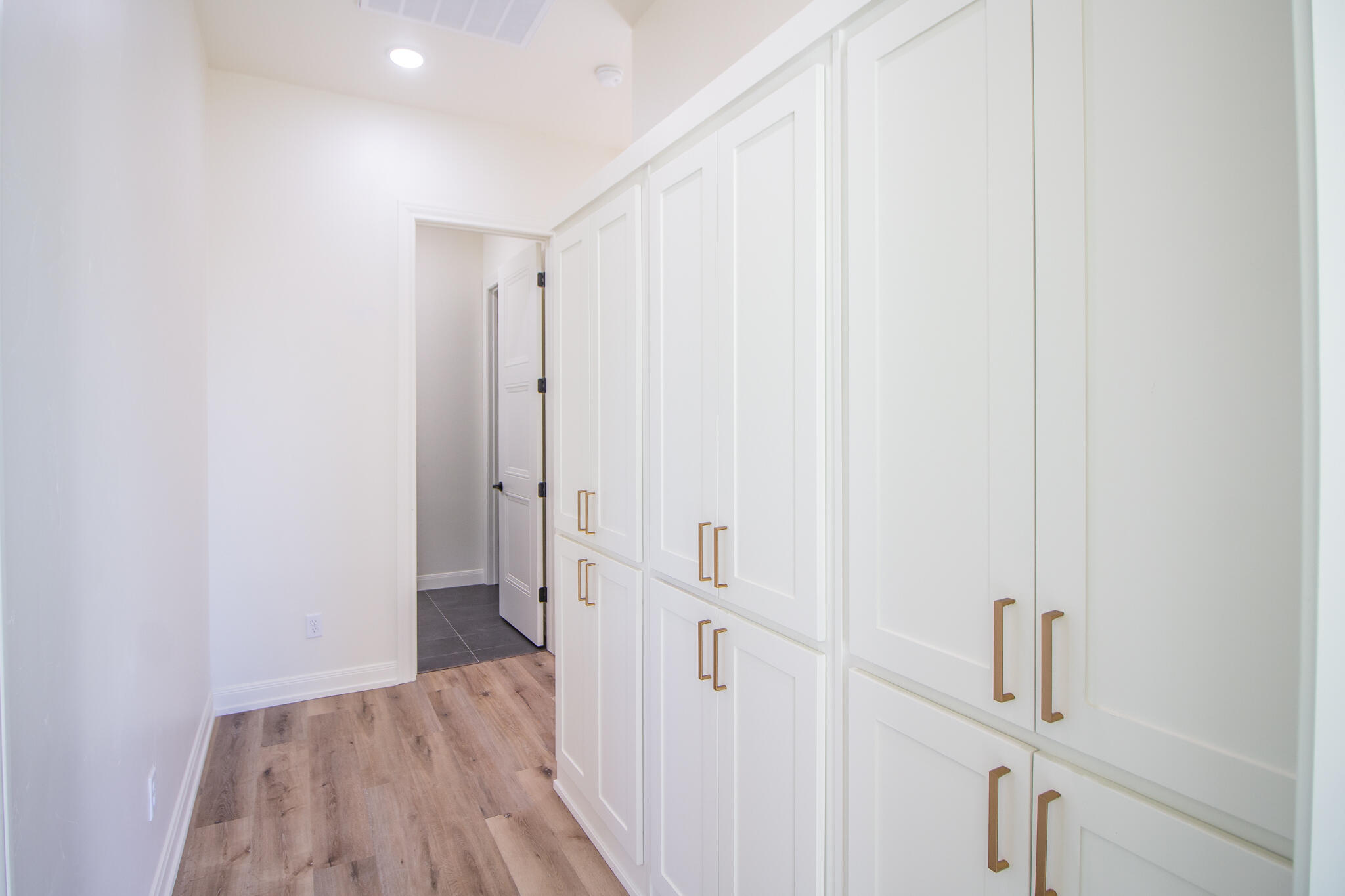 303 Juniper New Home, TX 79381 - Photo 26 of 31 a view of a hallway with wooden floor and entryway