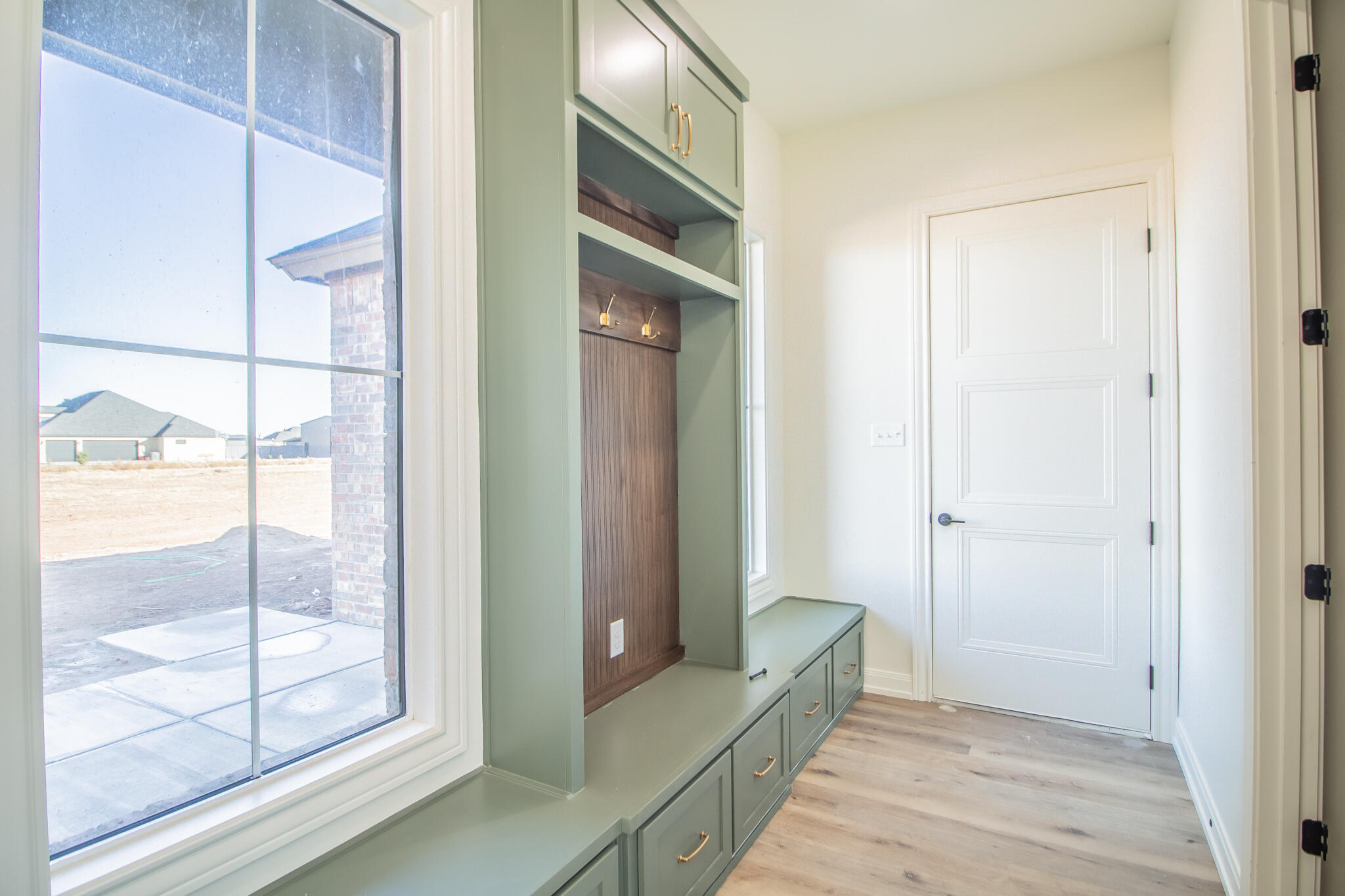 303 Juniper New Home, TX 79381 - Photo 27 of 31 a bathroom with a glass shower door and a bathtub