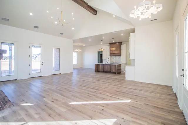 a view of a livingroom with a kitchen