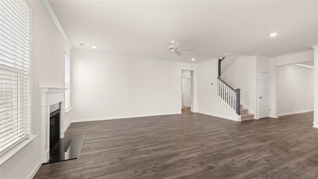1779 Goodwin Drive Hampton, GA 30228 - Photo 15 of 49 a view of empty room with wooden floor and fireplace