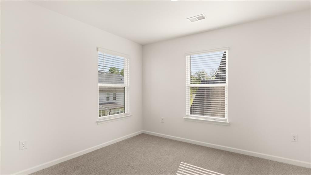 1779 Goodwin Drive Hampton, GA 30228 - Photo 24 of 49 a view of an empty room with a window