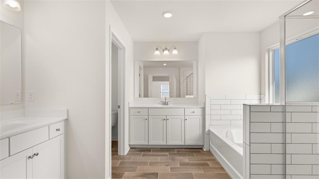 1779 Goodwin Drive Hampton, GA 30228 - Photo 25 of 49 a bathroom with a sink and a mirror
